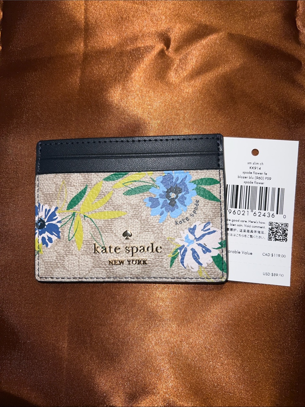 kate spade floral card holder in beige, navy, blue and green